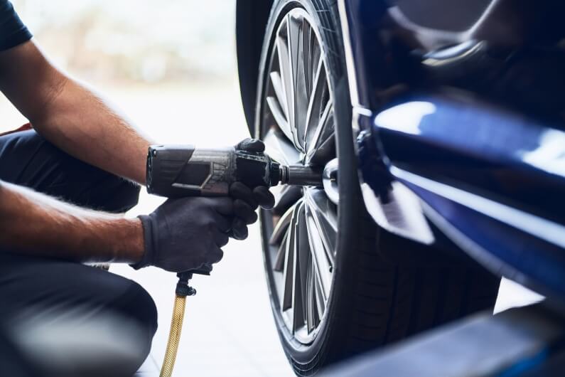 Mechanic Changing Car Wheel Tyre